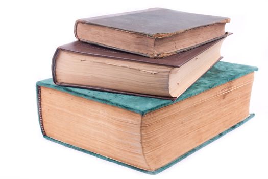 three old books on white background