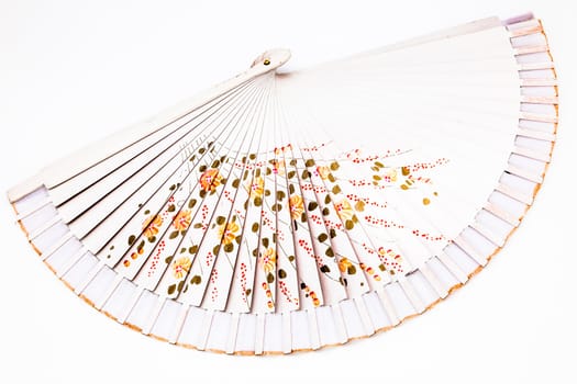 A beautiful spanish fan on a white background
