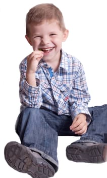 A little boy with candy on a white background
