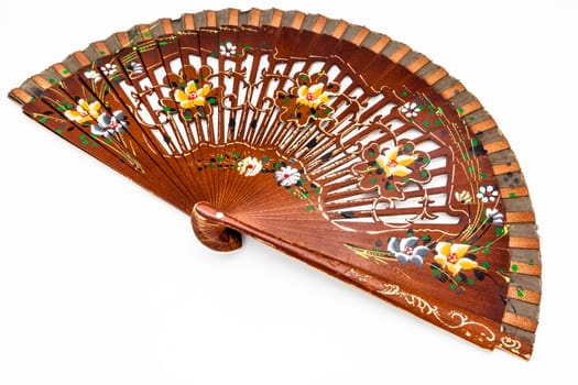 A beautiful spanish fan on a white background