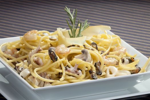 Italian pasta with seafood and rosemary