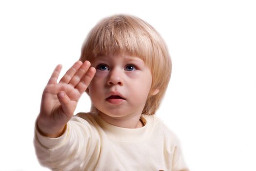 The little girl in a dress with arm outstretched on a white background