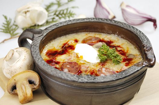 Mushroom soup with fried sausage