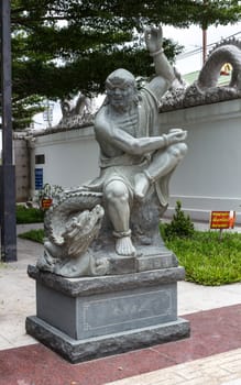 Statue of monk, chinese style, at Thai temple. Generality in Thailand, any kind of temple, art decorated in Buddhist church, temple etc. created with money donated by people to hire artist. They are public domain, no restrict in copy or use.This photo is taken under these conditions.