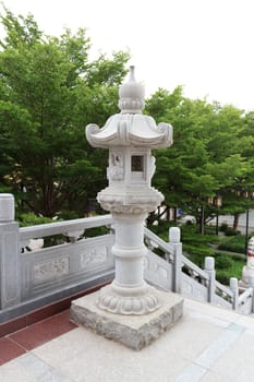 Traditional chinese stone lamp at temple,Thailand. Generality in Thailand, any kind of temple, art decorated in Buddhist church, temple etc. created with money donated by people to hire artist. They are public domain, no restrict in copy or use.This photo is taken under these conditions.