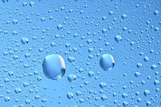 blue water bubbles on the window for background