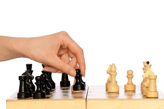 Woman playing chess and making black pawn move