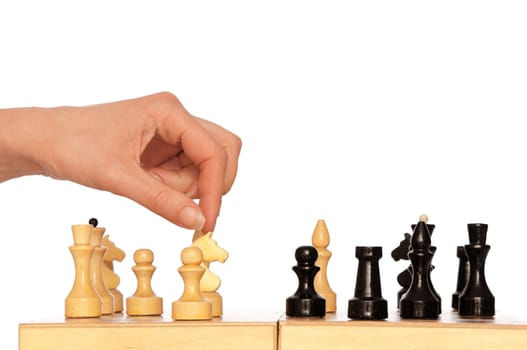 woman plays chess and chooses for victory next knight move