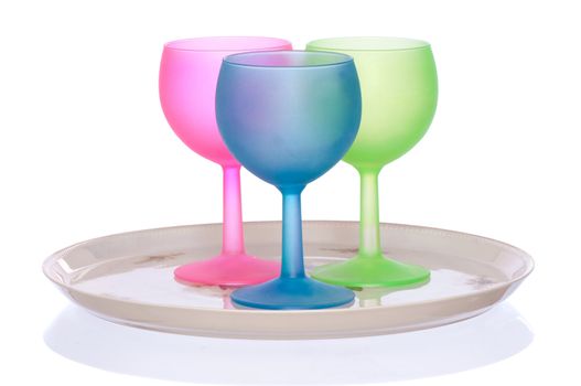 three colored wine glasses for cocktails on the tray for party