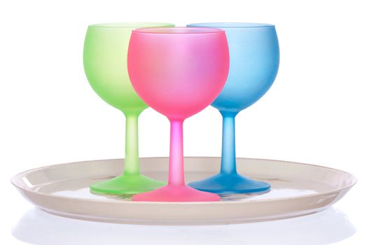 three colored wine glasses for cocktails on the tray for party