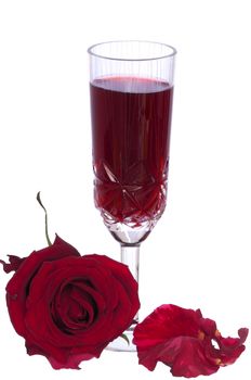 A glass of champagne with red rose on the party