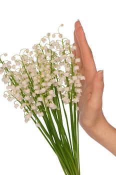 Woman holding lily of the valley in the hand