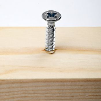 Screw in a piece of wood.