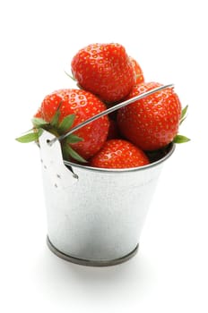 Little Tin Buckets with Perfect Ripe Strawberry isolated on white background