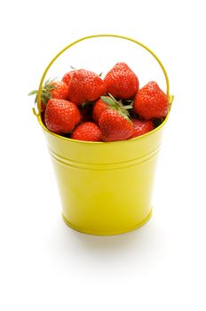 Yellow Bucket with Perfect Raw Strawberries isolated in white background