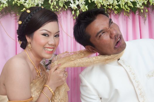 asian thai couple bride and bridegroom in thai wedding suit at wedding ceremony