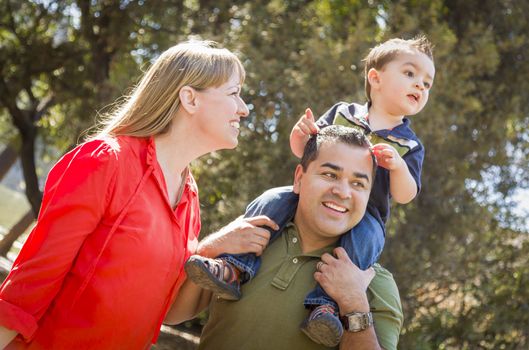 Happy Mixed Race Family with Enjoy a Walk in the Park.