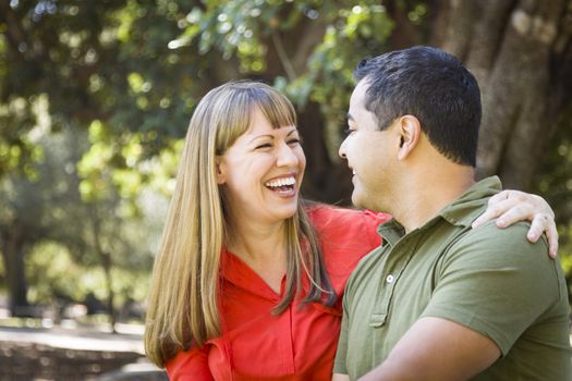 Happy Attractive Mixed Race Couple Enjoying A Day At The Park Together