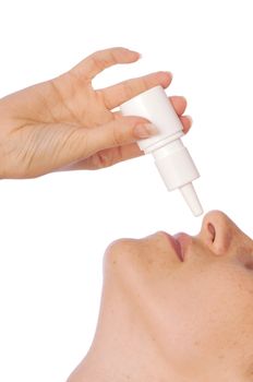 The woman drips drops for a nose for fast recover