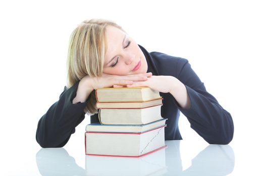 Tired blonde woman sleeping on books isolated on white Tired blonde woman sleeping on books isolated on white