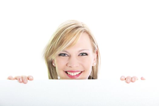 Studio shot of smiling blonde behind blank white board