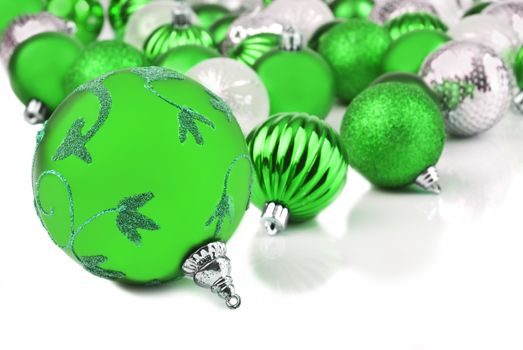 Green christmas ornament baubles on white background