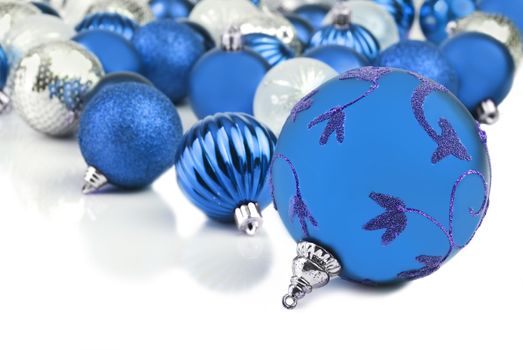 Blue christmas ornament baubles on white