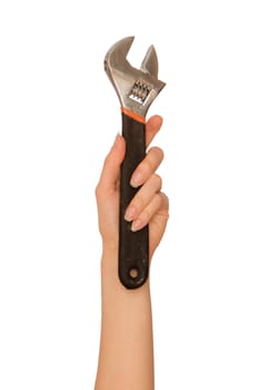 woman holding a adjustable spanner in the hand