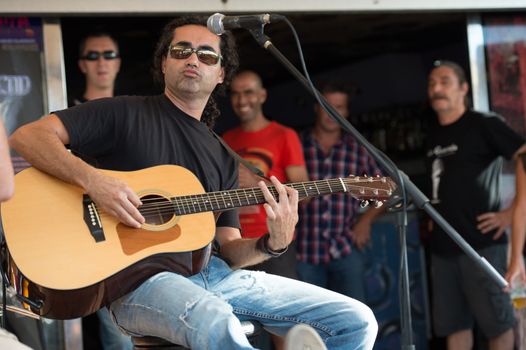 LAS PALMAS, SPAIN–SEPTEMBER 29, 2012: Guitarist Zack Monzon (right) playing in the new band Diskonectid, from Canary islands, during a concert at music bar La Guarida del Blues.