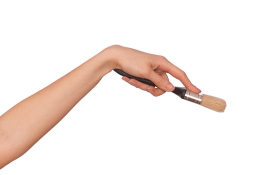 woman paints a picture with a brush