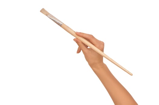 woman paints a picture with a brush