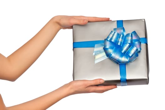 woman giving a silver box with blue bow as a gift