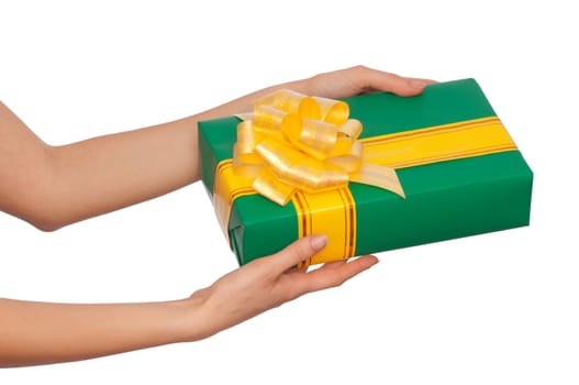 woman giving a green box with yellow bow as a gift