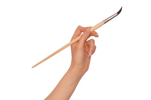 woman paints a picture with a brush