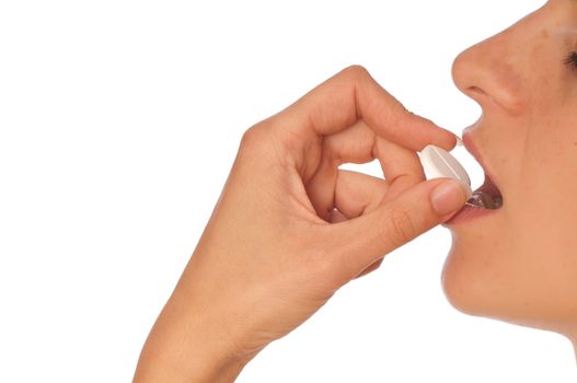 woman taking narcotic in a shape of white pill