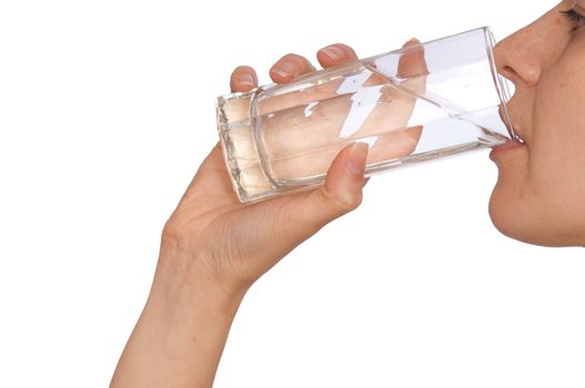 woman drinking mineral water from the glass