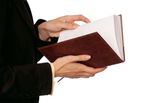 business woman reads book to get ideas for business plan