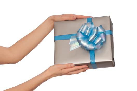 woman giving a silver box with blue bow as a gift