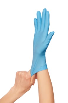 doctor putting on blue sterilized medical glove for making operation