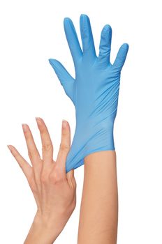 doctor putting on blue sterilized medical glove for making operation