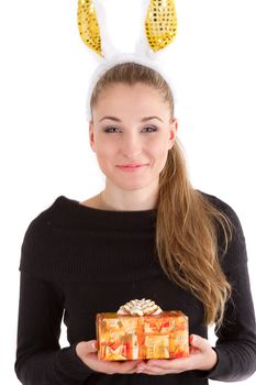 Portrait of a beautiful girl with rabbit ears with a gift in their hands