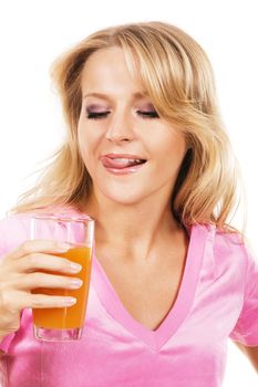 Lovely girl with fresh juice against white background