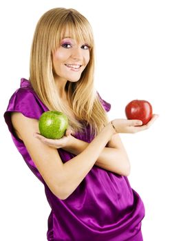 Young beautiful woman holding two apples, isolated on white background