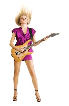 Attractive lady expressively playing an electric guitar