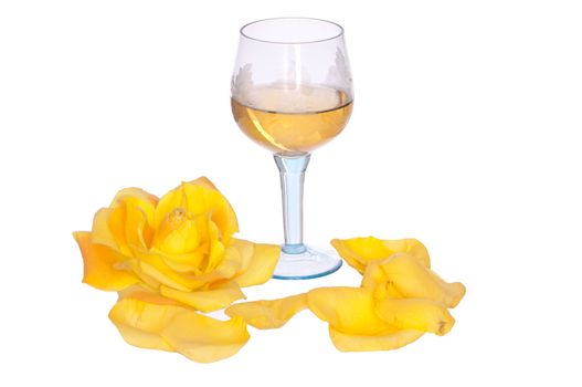 tumbler with white wine and yellow rose on the party