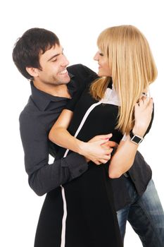 Beautiful young couple in casual clothing, white background