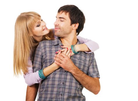 Romantic young couple in casual clothing, white background 