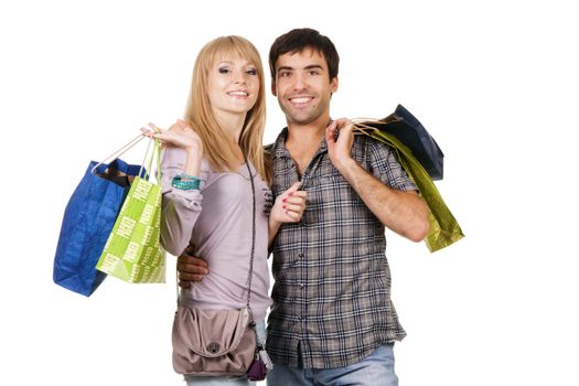 Beautiful young couple with shopping bags, isolated on white background