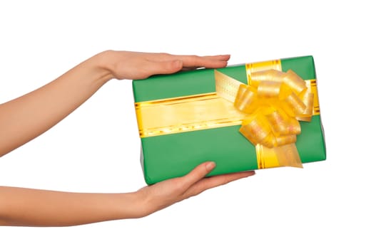 woman giving a green box with yellow bow as a gift