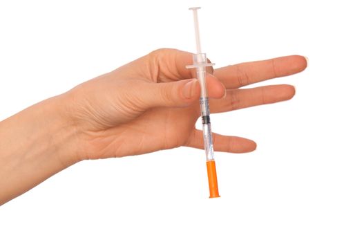 syringe in the woman's hand for making injections